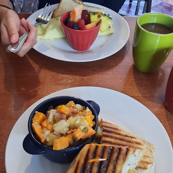 Breakfest. GF omelet with GF toast. Non-GF Hungry Papa egg bacon wrap with sweet potatoe hash.