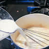 Thumbnail For Whisking Milk Into The Flour And Butter Mixture.