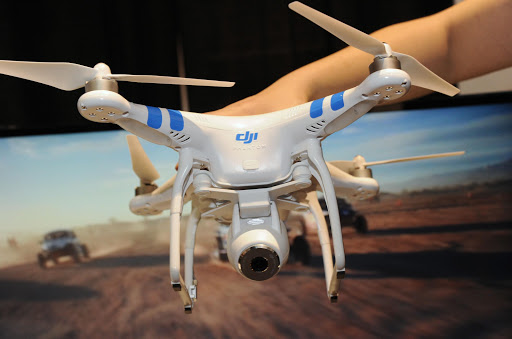 A DJI Innovations DJI Phantom 2 Vision aerial system drone is shown during "CES: Unveiled," the media preview for International CES, at the Mandalay Bay Convention Center.