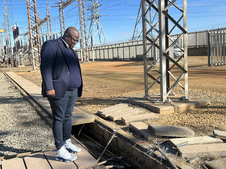 Utilities MMC Themba Fosi assesses the damage at Njala infeed substation.