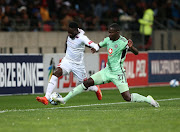 Augustine Mulenga of Chippa United is challenged by Tapelo Xoki of Orlando Pirates during their DStv Premiership match at Nelson Mandela Bay Stadium in Gqeberha on August 15 2023.