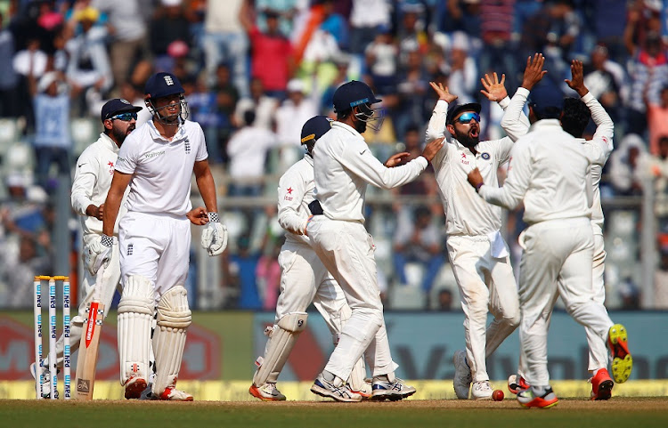 India captain Virat Kohli (centre) celebrate a wicket with teammates against England