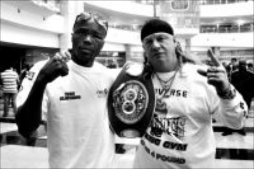 WORLD BEATERS: New IBF welterweight champion Isaac 'Angel' Hlatshwayo and his trainer Nick Durandt. PIC: Bafana Mahlangu. © Sowetan.