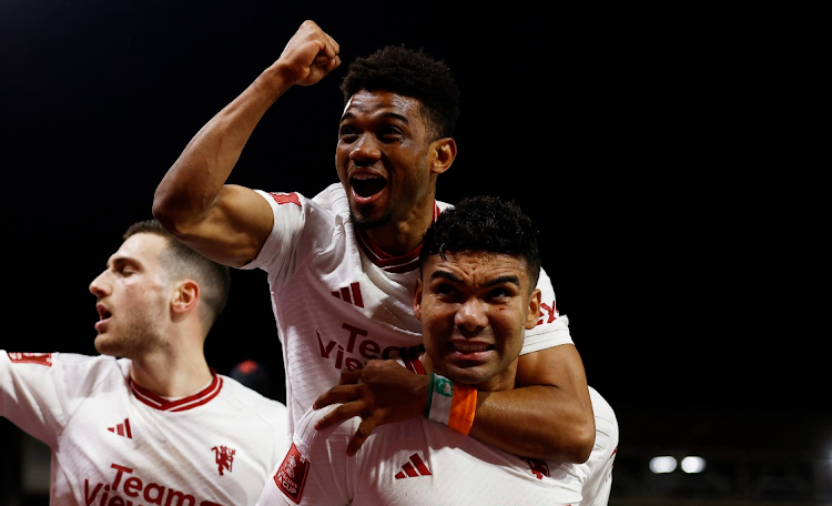 Casemiro celebrates scoring Manchester United's first goal with Amad Diallo in their FA Cup fifth round match against Nottingham Forest at The City Ground in Nottingham on Wednesday night.