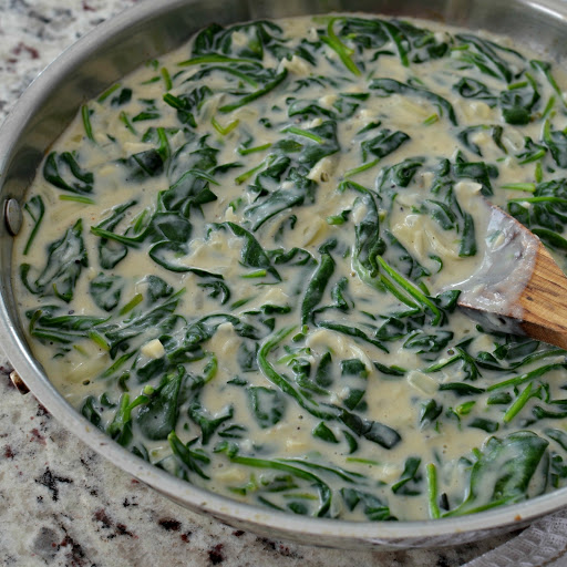 This made from scratch creamed spinach is one of my favorite sides.  Serve it over rice, noodles, baked potatoes, grits or just by itself.