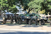 SANDF members seen in and around the Union Buildings in Pretoria as national shutdown protesters gather at Church Square to march to the Union Buildings in protest against President Cyril Ramaphosa on Monday March 20 2023.