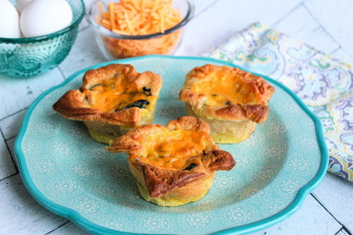 Spinach Quiche Muffins on a plate.