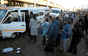 Workers queue at Baragwanath  taxi rank on their first day of  level 3 of the lockdown due to Covid-19  in South Africa./ANTONIO MUCHAVE