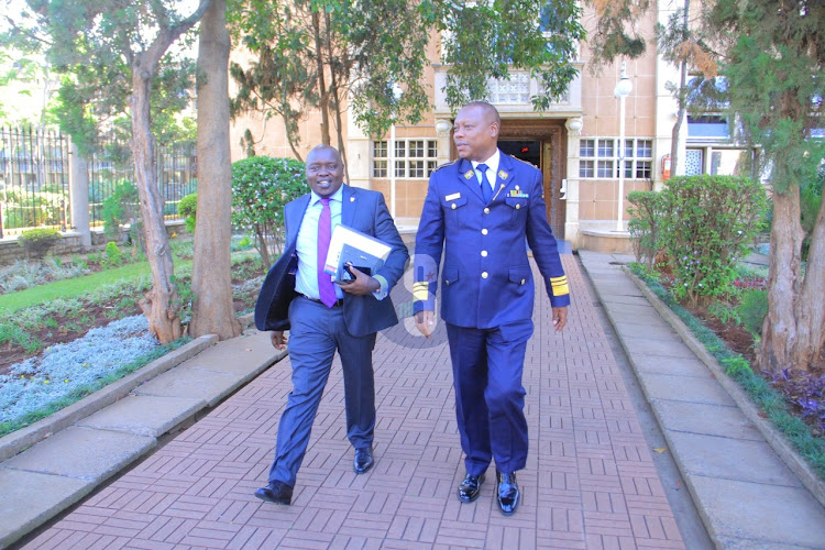 Nandi senator Samson Cherargei is escorted by a sergeant at arms out of the senate chambers after he was suspended by the speaker during the senate special sitting on December,30 2022