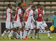 Bantu Mzwakali of Ajax Cape Town and team mates celebrate after scoring a goal during the Absa Premiership match between Ajax Cape Town and Bloemfontein Celtic at Athlone Stadium on October 21, 2017 in Cape Town, South Africa. 