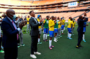 Mamelodi Sundowns chair Thlopie Motsepe, club officials and players applaud fans after their 1-0 Caf Champions League group stage win over Egyptian powerhouses Al Ahly at FNB Stadium on March 12 2022. Ahly said they have filed an official complaint after alleging Sundowns fans blocked their team bus en route to the match venue. 