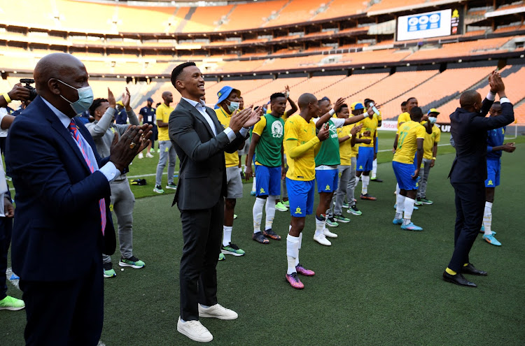 Mamelodi Sundowns chair Thlopie Motsepe, club officials and players applaud fans after their 1-0 Caf Champions League group stage win over Egyptian powerhouses Al Ahly at FNB Stadium on March 12 2022. Ahly said they have filed an official complaint after alleging Sundowns fans blocked their team bus en route to the match venue.