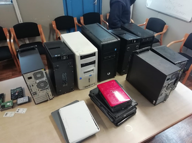 Police seized computers and a plethora of forged documents from a backyard internet cafe in Gugulethu, Cape Town, on Tuesday.