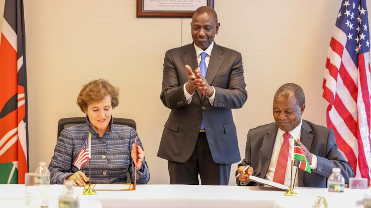 President William Ruto witnesses the signing of the deal between MCC CEO Alice Bright and Treasury Cabinet Secretary Njuguna Ndung'u in US on September 19, 2023.