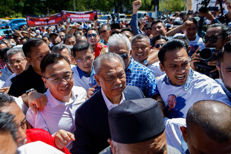 Muhyiddin Yassin, Malaysia's former prime minister, centre, arrives at the Malaysian Anti-Corruption Commission headquarters in Putrajaya, Malaysia, March 9 2023. Picture: SAMSUL SAID/BLOOMBERG