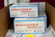 Boxes containing the Moderna Covid-19 vaccine are prepared for shipping at the McKesson distribution center in Olive Branch, Mississippi, US December 20 2020. 