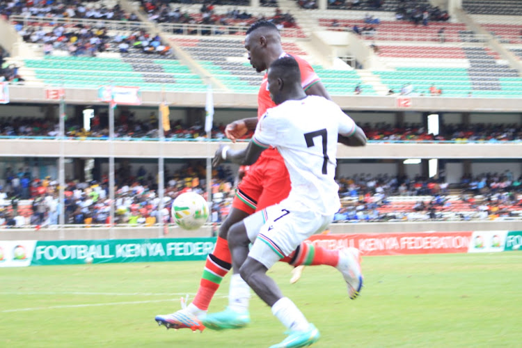 South Sudan's Jackson Dwang vies for the ball from Kenya's Agay Akumu during their friendly game at Moi sports Centre on September 12, 2023