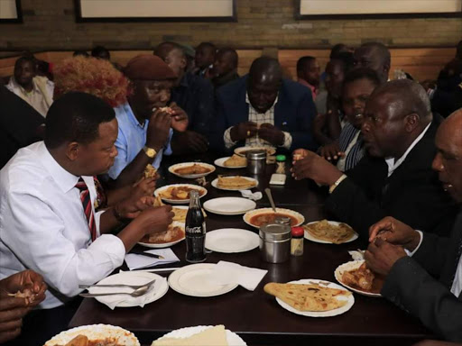 Machakos Governor Alfred Mutua has lunch with members of the public at T-TOT Hotel in Machakos town, May 31, 2018. /COURTESY