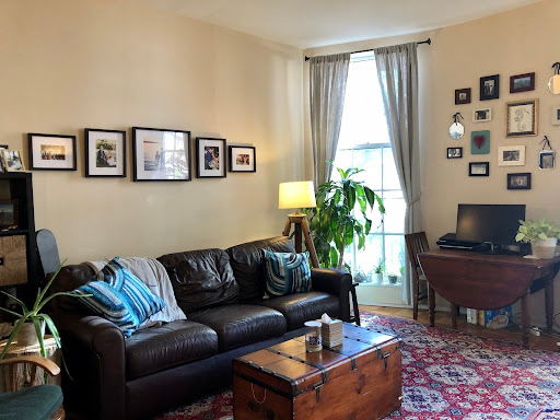 Living room with brown leather sofa - Rent this luxury apartment / penthouse in Boston, 1 bedroom