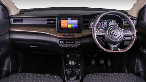 TX model further benefits from a touchscreen infotainment system and faux wood trim.