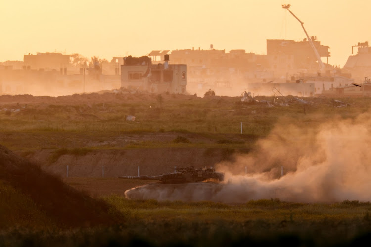 A tank drives along the Israeli side of the Israel-Gaza border fence in southern Israel, Israel, March 3 2024. Picture: REUTERS/Amir Cohen