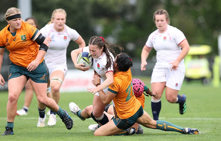 Lucy Packer of England is tackled during Rugby World Cup 2021 quarterfinal against Australia at Waitakere Stadium in Auckland, New Zealand on October 30 2022.