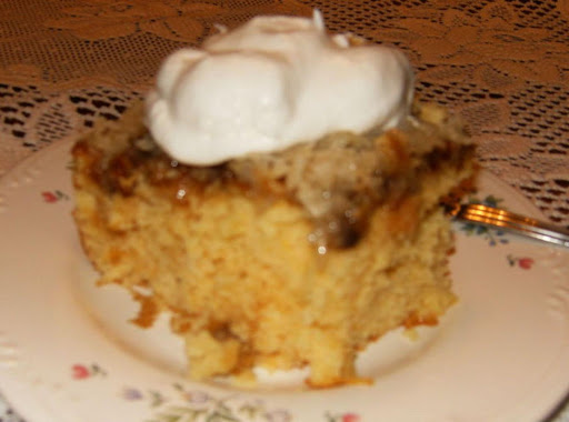 Ugly Duckling Cake with Pecans, topped with sugar-free Cool Whip.