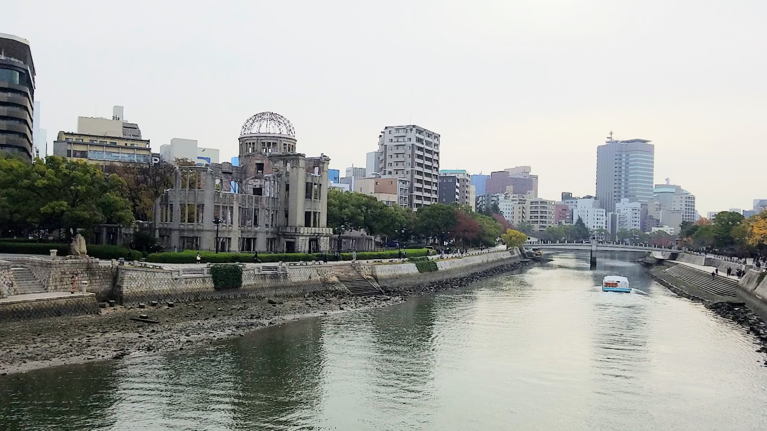 Looking north towards the Atomic Bone Dome from Aioi Bridge, supposedly this easy to spot and locate bridge was used for targeting the atomic bomb. The atomic bomb exploded at a height of 600 meters, 160 meters to the southeast of the Atomic Bomb Dome, aka essentially over this bridge. When the bomb detonated, the crowds of people who were either on, or around the bridge were killed instantly.