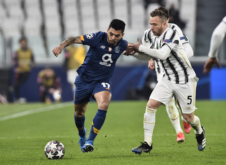 Juventus' Arthur in action with FC Porto's Jesus Corona