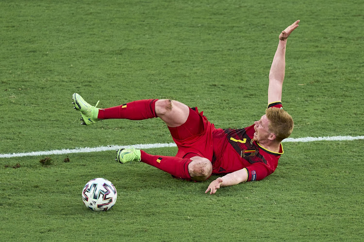 Kevin De Bruyne of Belgium lies injured on the pitch during the Uefa Euro 2020 Championship last-16 match against Portugal at Estadio La Cartuja in Seville, Spain on June 27, 2021.