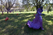 A likeness of artist Mary Sibande leading the sculptural procession 'Let Slip the Dogs of War' at Nirox Foundation.