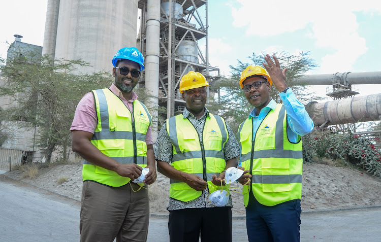 East African Portland Cement head of Finance Mohamed Osman, board chairman Brigadier Richard Mbithi listening to the firm's managing director Oliver Kirubai during a tour of the plant. It has been shutdown and is currently undergoing a 25-day maintenance meant to increase efficiency in production.