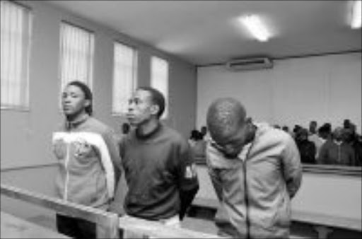 IN THE DOCK: Khumbulani Magagula, Johannes Mahlangu and Themba Mvubu in the Delmas circuit court in Mpumalanga yesterday for the murder of former Banya Banyana star Eudy Simelane. Pic: Vathiswa Ruselo. Circa. © Sowetan.