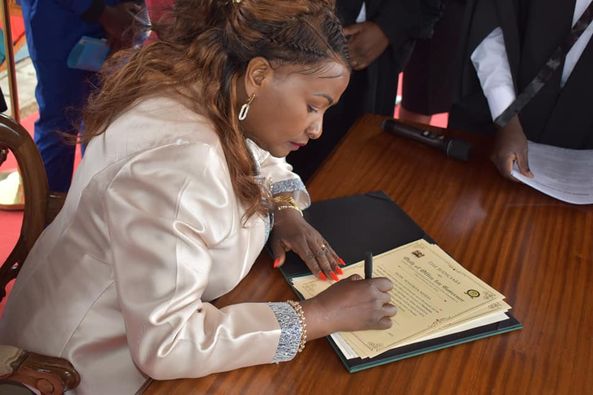 Machakos Governor Wavinya Ndeti signs documents during her swearing-in at Kenyatta Stadium in Machakos County on Thursday, August 25, 2022.