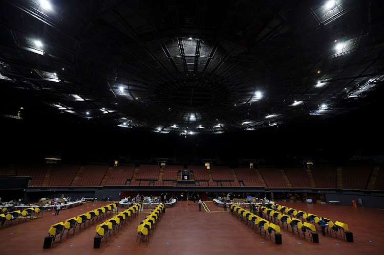 People vote in the US presidential election at the Forum on the first day of California in-person voting, amid the global outbreak of the coronavirus disease (Covid-19), in Los Angeles, California, US, October 24, 2020.