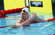 Pieter Coetzé in action at the Commonwealth Games in Birmingham, where he won the 100m backstroke, took silver in the 50m and bronze in the 200m.