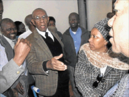 LOYALTY: Lucas Mangope is seen with his supporters outside the North West High Court after the hearing yesterday. Photo: Boitumelo Tshehle