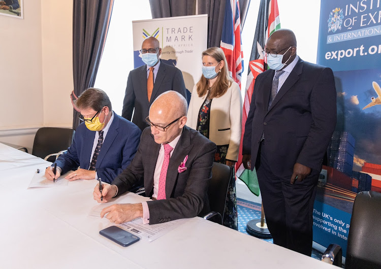 Trademark East Africa CEO Frank Matsaert and Institute of Export and International trade Director General Marco Forgione sign the TLIP MoU in London on July 26, 2021 at the Kenya High Commission in London.