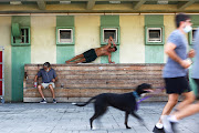 People exercise by the seaside as Israel imposes a second lockdown amid a rise in infections in Tel Aviv. 