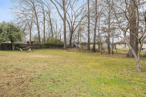 Large fenced yard with hammock in this luxury house for sale in Rossville ($279,500)