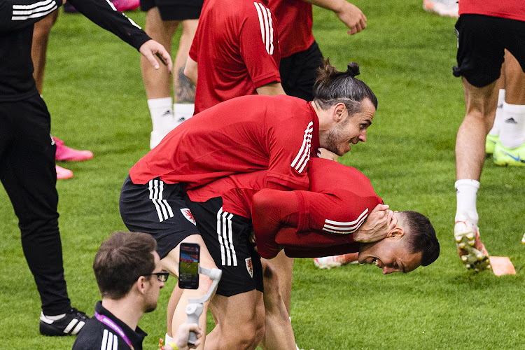 Gareth Bale (left) interacting with his teammate Connor Roberts of Wales in training at Johan Cruijff Arena in Amsterdam on June 25, 2021 ahead of their Uefa Euro 2020 round of 16 match against Denmark.