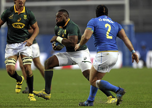 POWERING THROUGH: Tendai Mtawarira in action against Italy on Saturday. The loosehead prop was helped off the field in the first half after sustaining an injury.