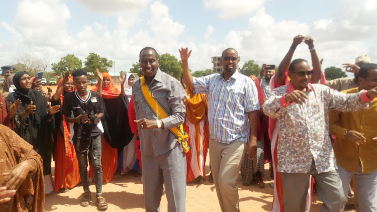 Wajir Governor Mohamed Abdi and other leaders join traditional dancers during Jamhuri Day celebrations at Wajir Stadium n Thursday