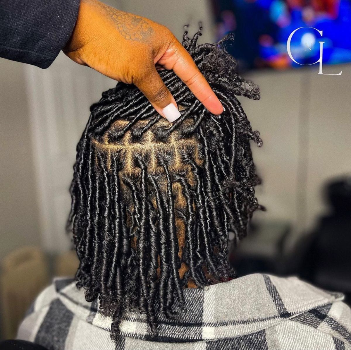 Backview of a lady rocking starter locs