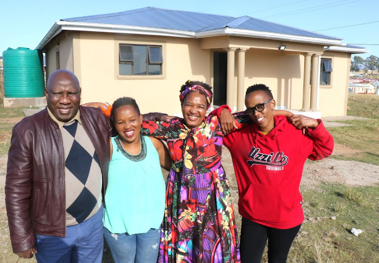 Receiving the house is Khululwa Mabhaso, 34, head of the family (SECOND LEFT), Eastern Cape Women's Magazine owner Pamela Timkwe (THIRD LEFT), and community activist Lungelwa Mabongo (RIGHT).