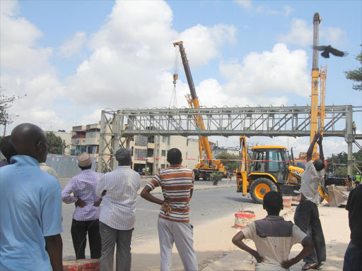 Members of the public looking at the State-of-the-art flyover at Buxton area./ELKANA JACOB