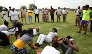 The community safety MEC Faith Mazibuko and premier Panyaza Lesufi watch potential recruits go through their paces at Modderbee Correctional Services. 