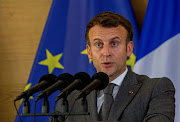 French President Emmanuel Macron speaks as he attends a joint news conference with Rwandan President Paul Kagame at the Presidential Palace in Kigali, Rwanda May 27, 2021. 