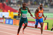 Akani Simbine of South Africa anchors his team home to win the race in round 1 of the mens 4x100m relay during day 8 of the IAAF World Athletics Championships at Khalifa International Stadium on October 04, 2019 in Doha, Qatar. 