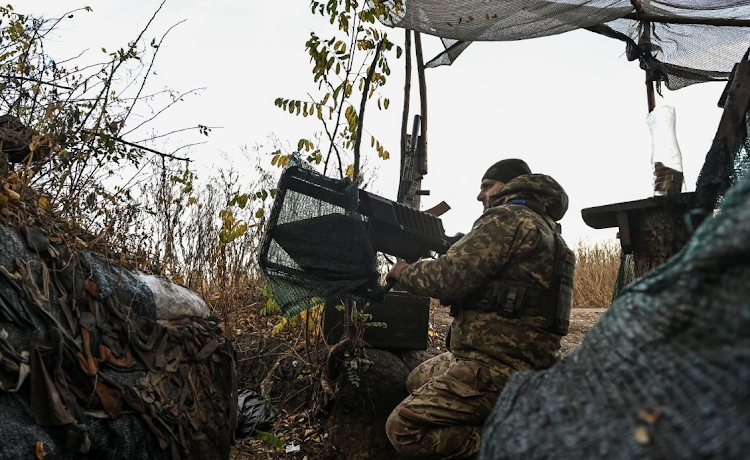 A Ukrainian serviceman uses an anti-drone rifle at a position in a frontline, amid Russia's attack on Ukraine, in the Zaporizhzhia region. Picture: REUTERS